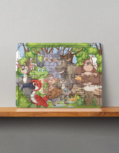 Colorful MDF wooden puzzle showing cartoon forest animals including deer, frog, bird, and bear on a shelf