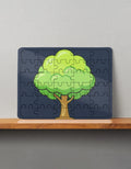 30-piece wooden puzzle with a green tree illustration on a dark blue background, displayed on a wooden shelf